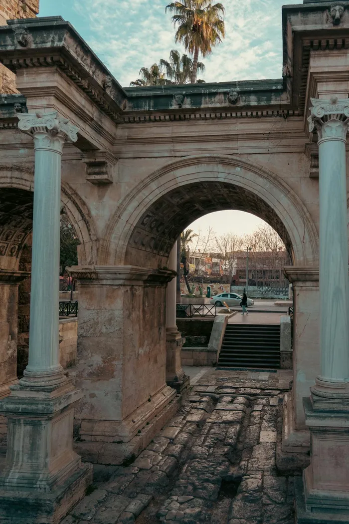 Hadrian's Gate in Antalya, Turkey — a Roman triumphal arch in the heart of the old town, near leading dental clinics serving UK patients